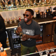 ORLANDO, FLORIDA - SEPTEMBER 16: Kevin Hart prepares cocktails during the presentation of his new goblets made with his Gran Coramino Tequila at Sugar Factory American Brasserie on September 16, 2022 in Orlando, Florida